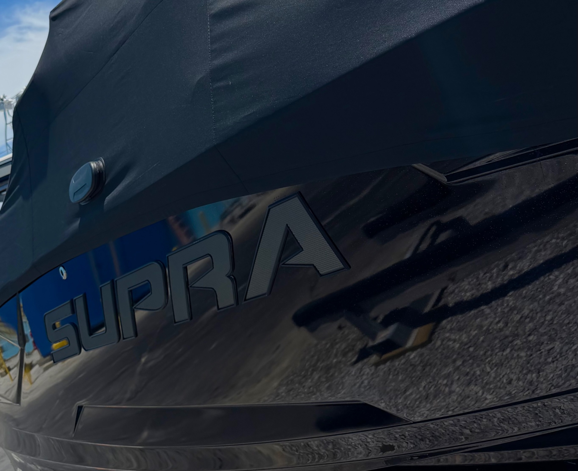 Premium Supra wake boat on emerald water