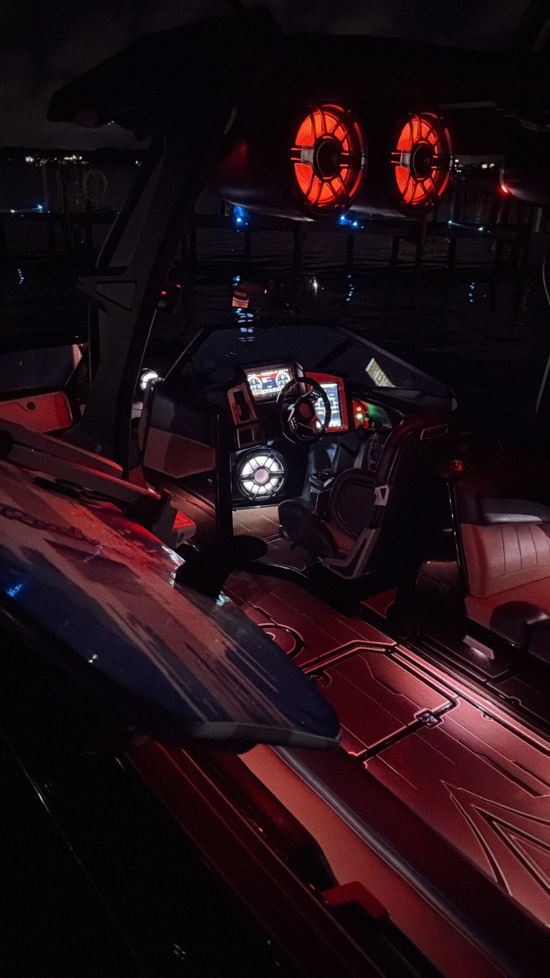 Night photo of the Supra interior glowing with red lighting