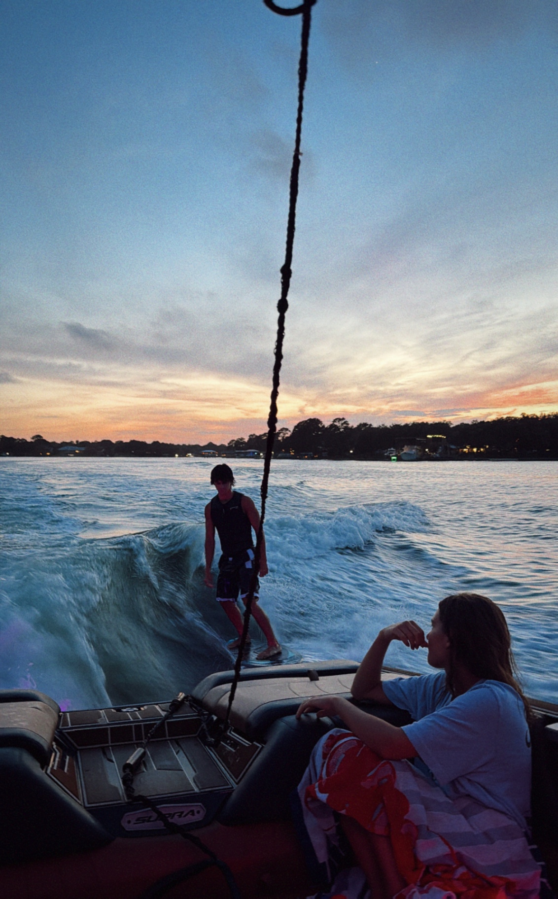 Sunset wakesurf session with friends on board the Supra